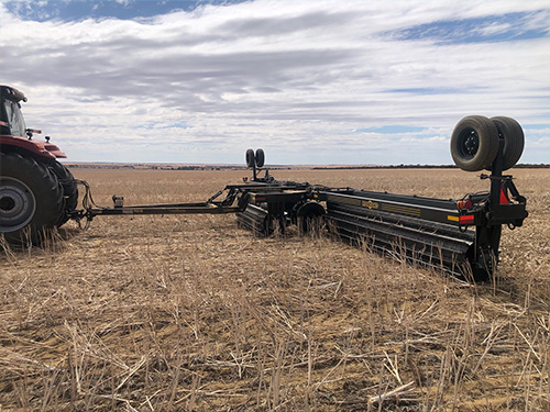 Machine moving over dry paddock